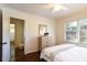 Spacious bedroom with hardwood floors, decor, and natural lighting, offering comfort and convenience at 1239 Reece Rd, Charlotte, NC 28209