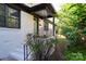 Charming front porch with decorative iron railings, new steps, and landscaped yard at 1239 Reece Rd, Charlotte, NC 28209