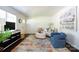 Open living room featuring hardwood floors, and a comfortable seating area at 1239 Reece Rd, Charlotte, NC 28209