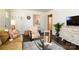 Bright living room boasts hardwood floors, decor, and a comfortable seating arrangement, filled with natural light at 1239 Reece Rd, Charlotte, NC 28209