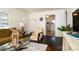 Inviting living room featuring hardwood floors, a stylish rug, and a comfortable seating arrangement at 1239 Reece Rd, Charlotte, NC 28209