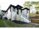Charming home with a freshly painted brick exterior and a cozy backyard deck at 1239 Reece Rd, Charlotte, NC 28209