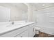 Bathroom featuring dual sinks, framed mirror, and tub with shower at 124 Rustling Waters Dr, Mooresville, NC 28117