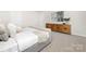 Bright bedroom featuring neutral decor, plush carpeting, and a stylish console table with modern artwork at 124 Rustling Waters Dr, Mooresville, NC 28117