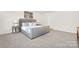 Serene bedroom featuring a gray upholstered bed, matching side tables, and neutral decor with carpet floors at 124 Rustling Waters Dr, Mooresville, NC 28117