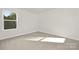 Bright, open bedroom featuring plush carpeting and a window with natural light streaming in at 124 Rustling Waters Dr, Mooresville, NC 28117