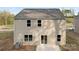 Back exterior of home with gray siding, gray roof, and sliding glass door at 124 Rustling Waters Dr, Mooresville, NC 28117