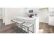 Bright kitchen featuring white cabinets, stainless steel appliances, and a quartz-topped island with seating at 124 Rustling Waters Dr, Mooresville, NC 28117