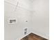 Laundry area with wood-look flooring and washer/dryer hookups at 124 Rustling Waters Dr, Mooresville, NC 28117