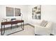 Cozy office with modern desk setup, comfortable chair, and eye-catching wall art at 124 Rustling Waters Dr, Mooresville, NC 28117