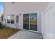 Backyard patio with the home's windows and sliding glass door at 136 S Bell Ave, Albemarle, NC 28001