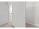 A bedroom with a closet and a door leading to the upstairs area of the house at 136 S Bell Ave, Albemarle, NC 28001