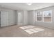 Bright bedroom features carpet and lots of natural light at 136 S Bell Ave, Albemarle, NC 28001