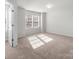 Bright bedroom with carpet and lots of natural light at 136 S Bell Ave, Albemarle, NC 28001