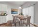 Dining room with dining table, chairs, and white cabinets at 136 S Bell Ave, Albemarle, NC 28001