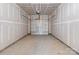 Interior shot of the garage with drywall and an automatic garage door at 136 S Bell Ave, Albemarle, NC 28001