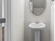 Powder room features white pedestal sink at 136 S Bell Ave, Albemarle, NC 28001