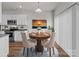 Cozy dining area with a round table and modern chairs, illuminated by a stylish pendant light at 138 S Bell Ave, Albemarle, NC 28001