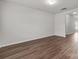 A spacious living room features stylish wood floors and neutral walls, creating a welcoming atmosphere at 138 S Bell Ave, Albemarle, NC 28001