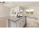 Beautiful open kitchen featuring white cabinetry, granite countertops, and stainless steel appliances at 146 Jacobs Hill Pl, Troutman, NC 28166