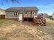 Backyard view features a wooden deck with stairs leading to the spacious yard at 1971 Bristol Pkwy, Rock Hill, SC 29732