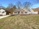 Charming brick and siding home with a manicured front yard and mature trees at 1971 Bristol Pkwy, Rock Hill, SC 29732