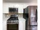 Modern kitchen with stainless steel appliances and white cabinets at 1971 Bristol Pkwy, Rock Hill, SC 29732