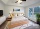 Staged main bedroom featuring a tray ceiling, large window, and a comfortable king bed at 1971 Bristol Pkwy, Rock Hill, SC 29732