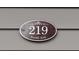 Close-up of the address plaque displaying 