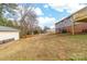 Spacious backyard featuring a well-maintained lawn, utility building, and potential for outdoor activities at 219 Ferstl Ave, Belmont, NC 28012