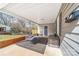 Relaxing covered patio featuring comfortable seating, a ceiling fan, and ample space for outdoor enjoyment at 219 Ferstl Ave, Belmont, NC 28012