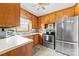 Efficient kitchen with stainless steel appliances, and wood cabinetry at 219 Ferstl Ave, Belmont, NC 28012