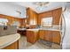 Charming kitchen featuring wooden cabinets, tile flooring and stainless steel appliances at 219 Ferstl Ave, Belmont, NC 28012