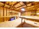 Bright interior of the utility building with wooden beams, shelving, and ample workspace at 219 Ferstl Ave, Belmont, NC 28012