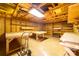 Inside the utility building showing exposed trusses, lighting and multiple work tables at 219 Ferstl Ave, Belmont, NC 28012