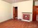 Cozy living room featuring a decorative fireplace and original hardwood floors at 2412 Daves Dr, Shelby, NC 28152