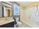Bathroom featuring a shower-tub combo, a window, and vanity with sink at 305 Plantation Dr, Kings Mountain, NC 28086
