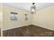 Inviting bedroom with two windows and a geometric light fixture at 305 Plantation Dr, Kings Mountain, NC 28086