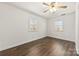 Bright bedroom with natural light, hardwood floors, and two large windows for ample sunlight at 305 Plantation Dr, Kings Mountain, NC 28086