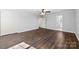 Spacious bedroom featuring wood-look floors and neutral paint with access to en-suite bathroom at 305 Plantation Dr, Kings Mountain, NC 28086