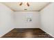 Bright bedroom features wood-look floors, neutral wall paint and window overlooking outside at 305 Plantation Dr, Kings Mountain, NC 28086