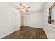 Inviting bedroom featuring hardwood floors, ceiling fan, and well-lit space at 305 Plantation Dr, Kings Mountain, NC 28086