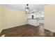 Spacious dining room featuring a modern light fixture and views of the kitchen at 305 Plantation Dr, Kings Mountain, NC 28086