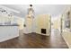 Open-concept dining area with modern lighting, connecting to the kitchen and other living spaces at 305 Plantation Dr, Kings Mountain, NC 28086