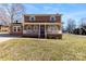 Charming two-story brick home with a welcoming front porch and well-maintained lawn at 305 Plantation Dr, Kings Mountain, NC 28086