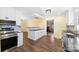 Open kitchen with an island, modern appliances, and updated lighting at 305 Plantation Dr, Kings Mountain, NC 28086