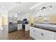 Renovated kitchen with stainless steel appliances, modern cabinetry, and eat-in bar at 305 Plantation Dr, Kings Mountain, NC 28086