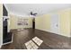 Spacious living room featuring hardwood floors, large windows, and neutral wall color at 305 Plantation Dr, Kings Mountain, NC 28086
