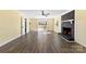 Bright living room featuring a black brick fireplace and sliding glass doors to the backyard at 305 Plantation Dr, Kings Mountain, NC 28086