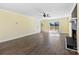 Living room with hardwood floors, ceiling fan, fireplace, and sliding glass doors at 305 Plantation Dr, Kings Mountain, NC 28086